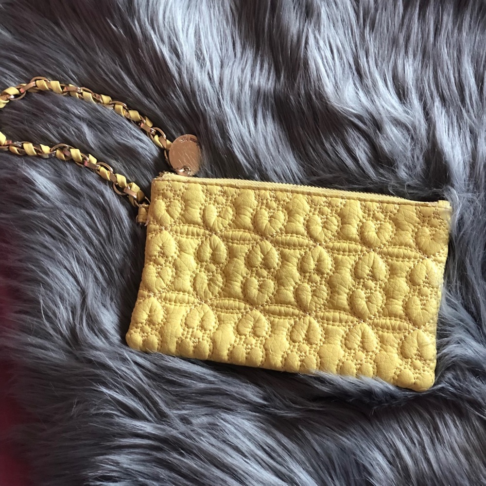 Deuce Lux clutch yellow with teal lining.
